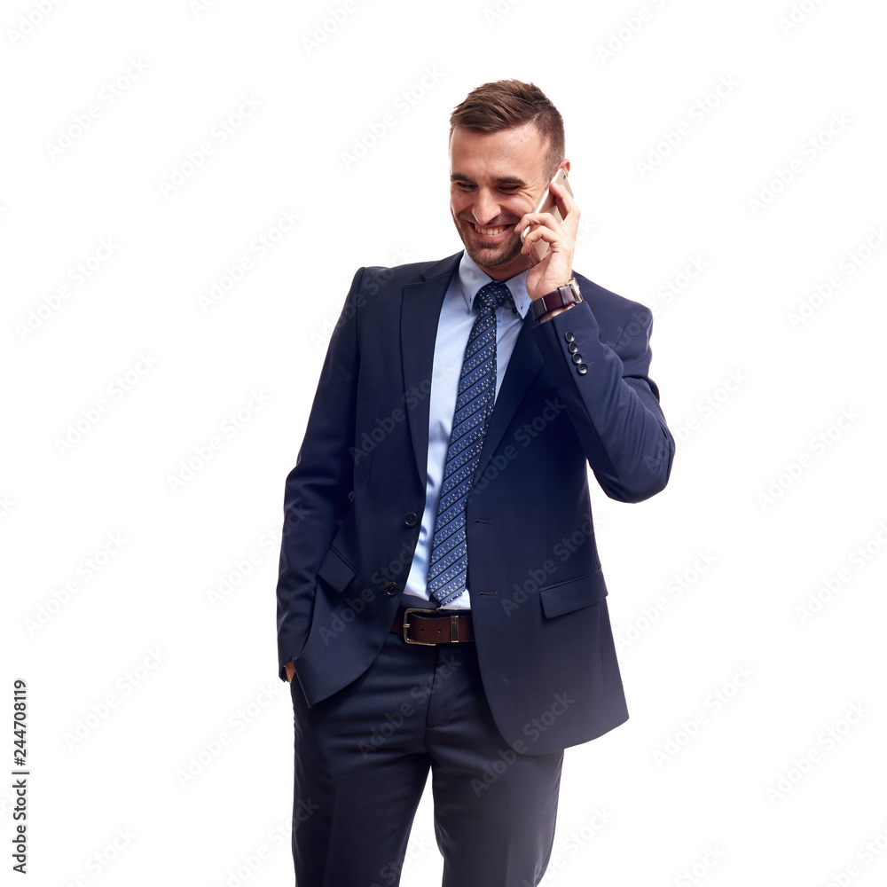 Portrait of a smiling young business man using smartphone and holding cup of coffee isolated on a white background Portrait of a smiling young business man using smartphone and holding cup of coffee isolated on a white background