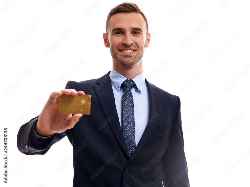 Confident young business man standing isolated over white background, showing credit card Confident young business man standing isolated over white background, showing credit card
