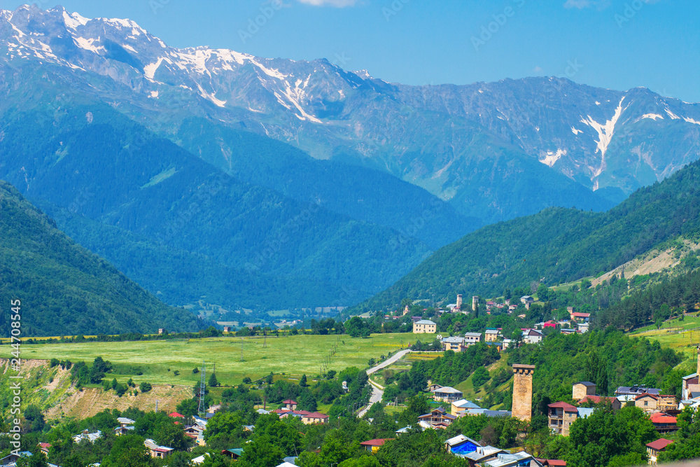 View on Mestia village in Svaneti valley near mountain range.