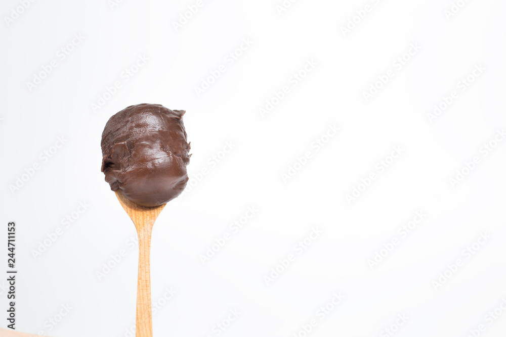 Spoon with chocolate Nutella cream on a white background. Stock Photo |  Adobe Stock