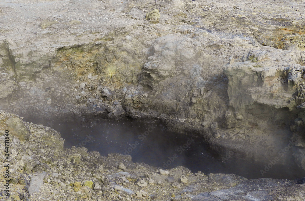 Black boiling mud pool