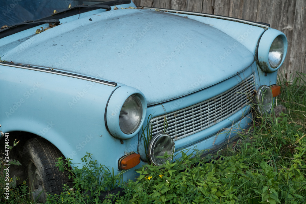 Old Eastern Europe GDR car is in the green meadow Old Eastern Europe GDR car is in the green meadow