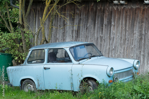 Canvas Print Old Eastern Europe GDR car is in the green meadow