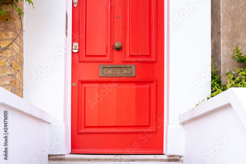 Quadro su tela Beautiful red door with letterbox in a white house facade in Notting Hill