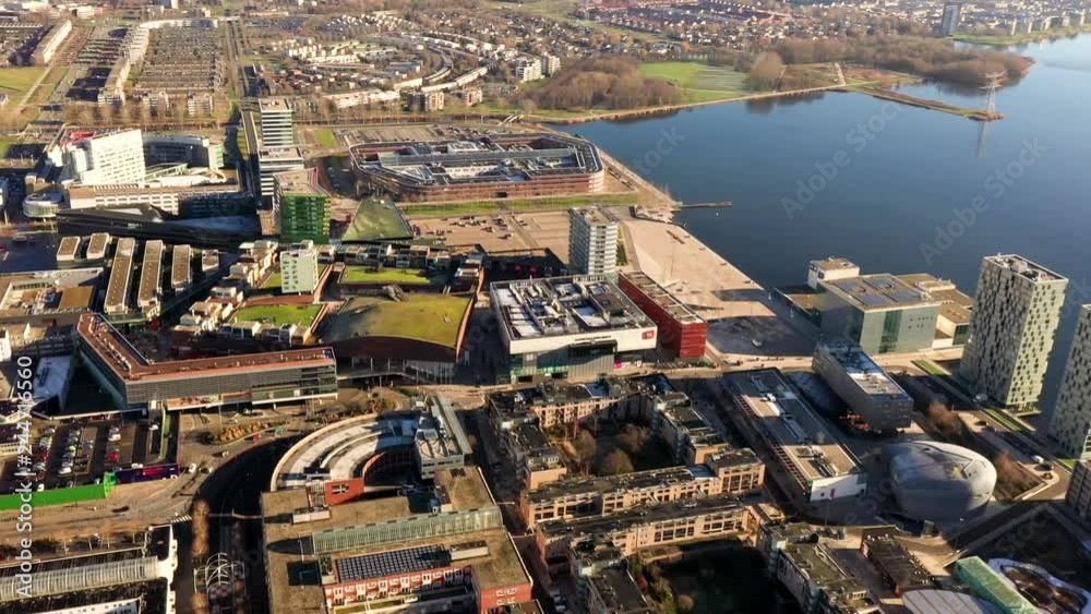 Aerial view of Almere City with its business buildings and lake Aerial view of Almere City with its business buildings and lake
