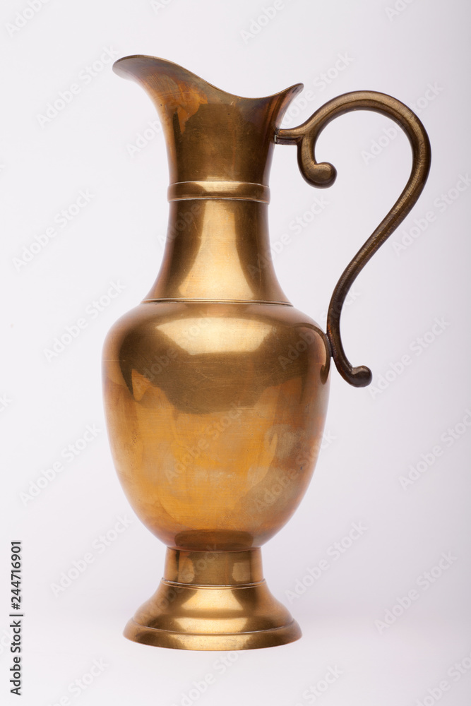 Renaissance wine brass carafe on the white background,