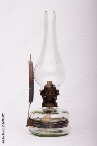 Old petroleum lamp on the white background photo