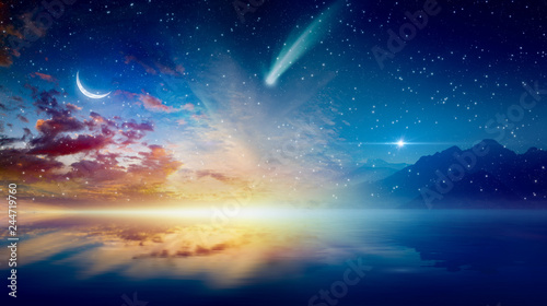 Fototapeta Naklejka Na Ścianę i Meble -  Crescent moon, glowing horizon, bright stars and comet