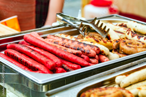 Closeup shot of sausages on the metal tray