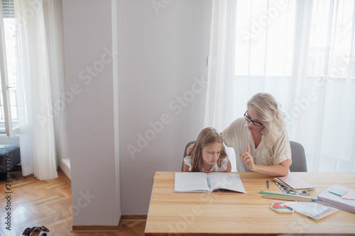 Schoolgirl Studying at Home