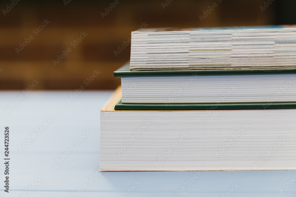 Stack of student education books on wood table Stack of student education books on wood table