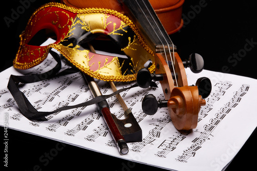Violin, theater mask and notes. © Dmitriy Melnikov