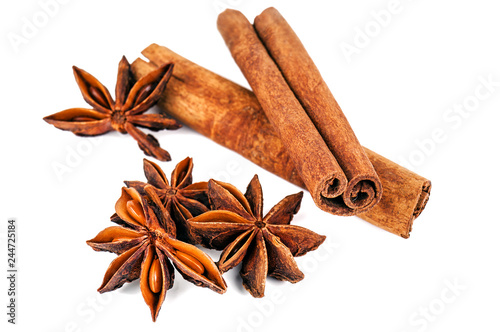 cinnamon sticks and anise stars on white