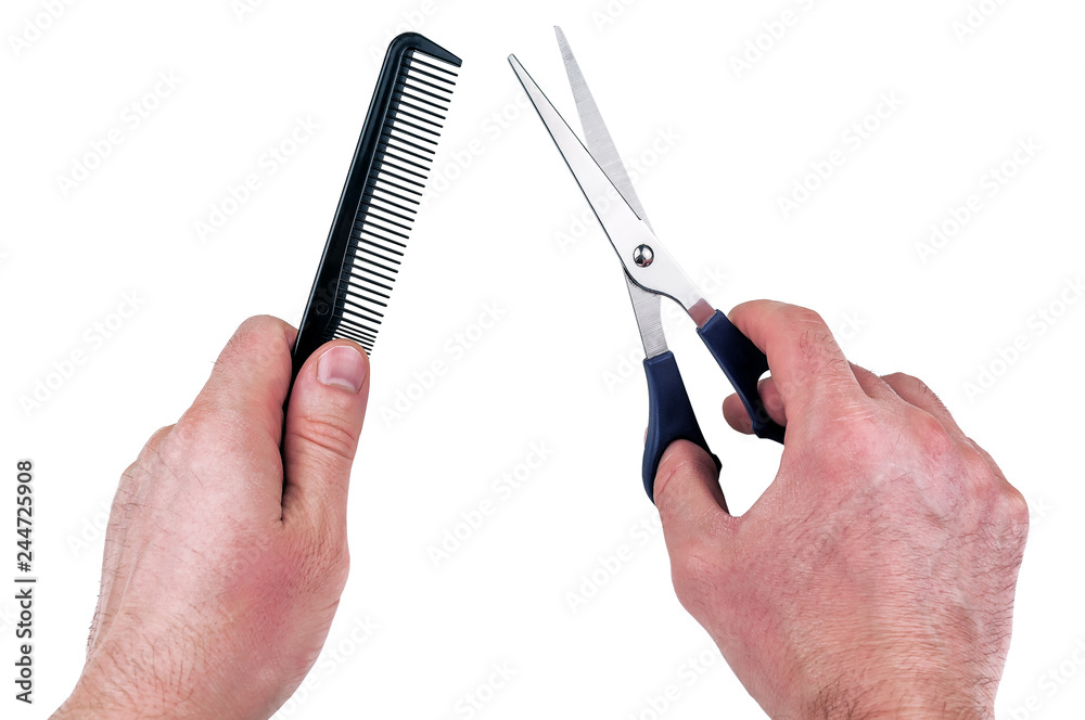 hairdressing scissors and a comb in the hands hairdressing scissors and a comb in the hands