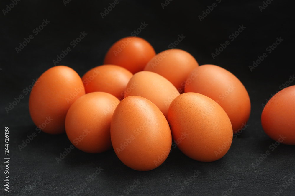 Brown chicken eggs isolated on black, selective focus Brown chicken eggs isolated on black, selective focus