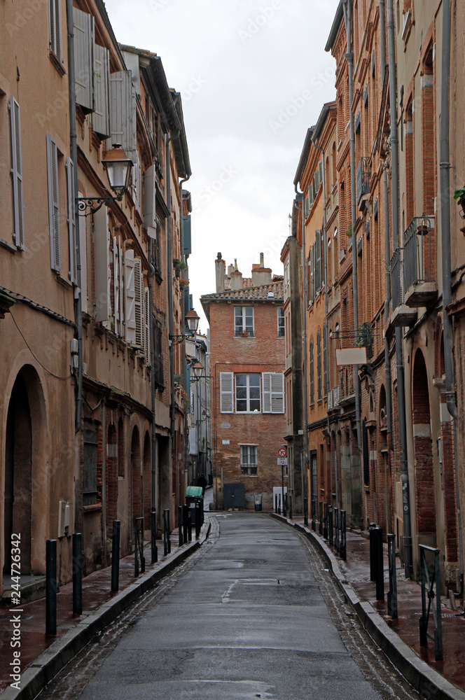 the narrow street in french city Toulouse