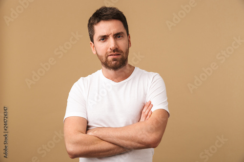 Portrait of a confused young man casually dressed