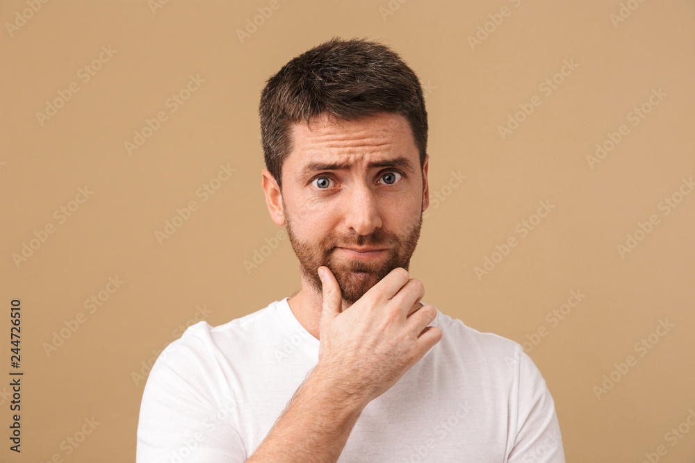 Portrait of a confused young man casually dressed Portrait of a confused young man casually dressed