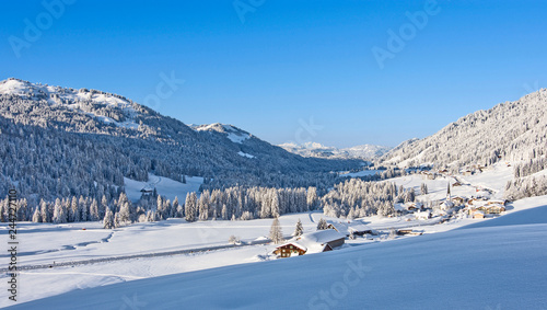 Deeply snow-covered landscape in the mountains with forests and the mountain village Balderschwang at a beautiful winter day. Bavaria, Germany © Andreas Föll