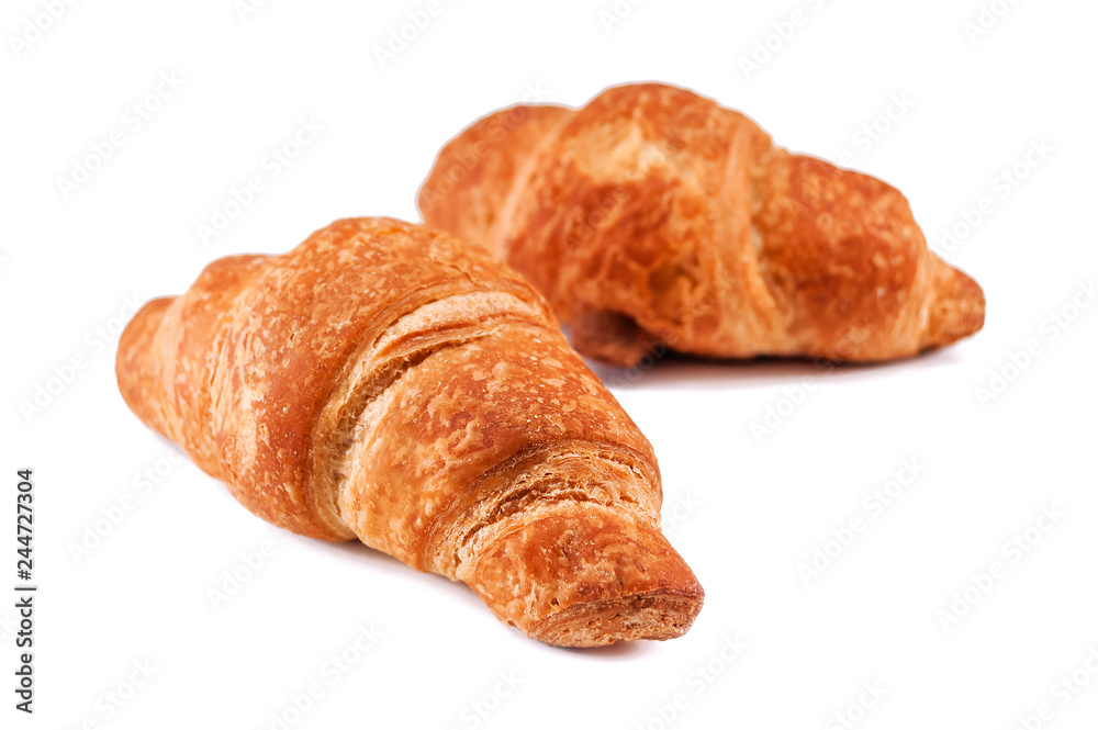 two crispy croissants on white two crispy croissants on white