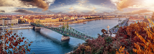 Aerial panorama of Budapest, Hungary. Sunset over the city with the Liberty Bridge, the Danube river.