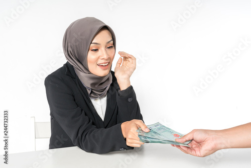 Hijab businesswoman and money with white background.