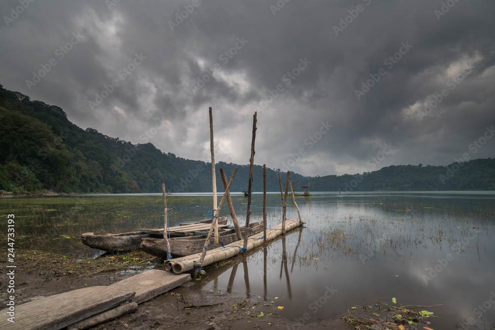 Wooden boat with lake background