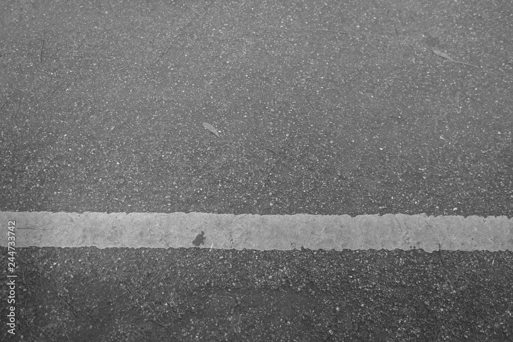 Fototapeta premium The road with white lines is horizontal