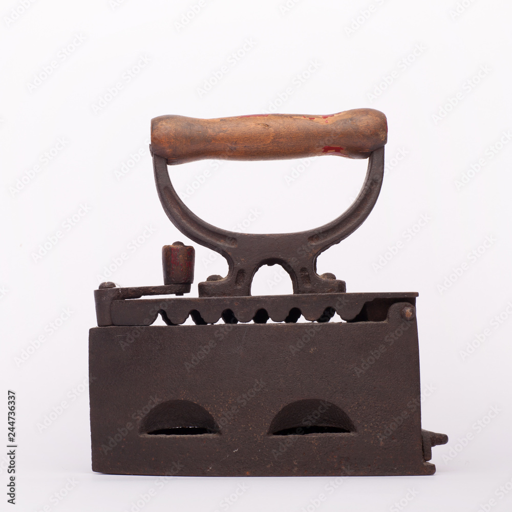 Old metal flat iron on the white background Old metal flat iron on the white background
