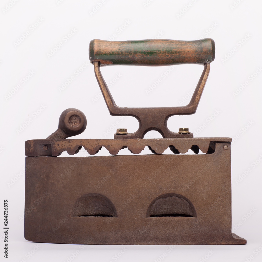 Old metal flat iron on the white background Old metal flat iron on the white background