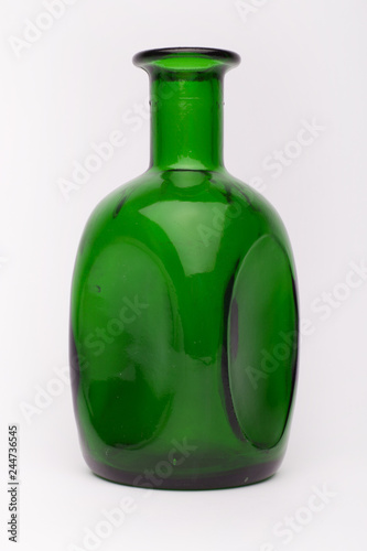 Green wine bottle on the white background