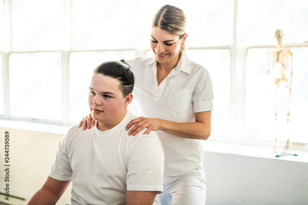 A Modern rehabilitation physiotherapy woman worker with client A Modern rehabilitation physiotherapy woman worker with client