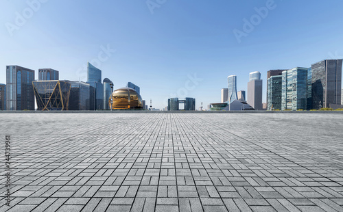 Panoramic skyline and buildings with empty concrete square floor，Qianjiang New Town，hangzhou,china photo