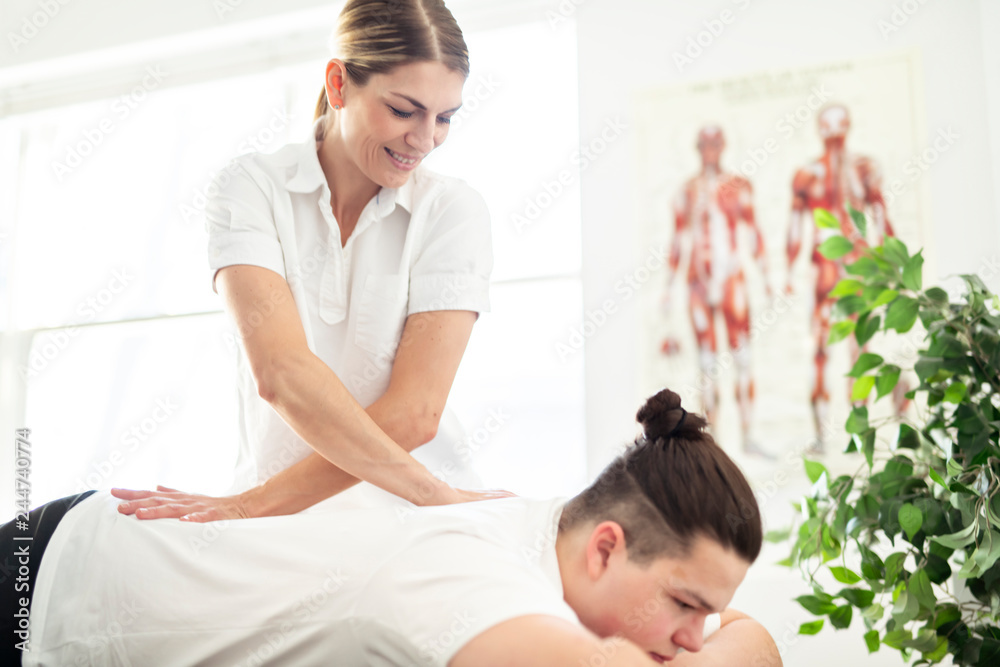 A Modern rehabilitation physiotherapy woman worker with client A Modern rehabilitation physiotherapy woman worker with client