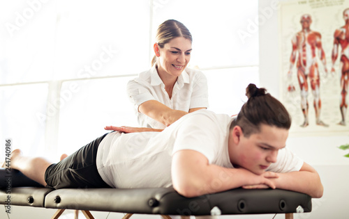 A Modern rehabilitation physiotherapy woman worker with client