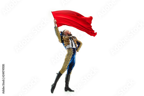 Obraz na plátne Torero in blue and gold suit or typical spanish bullfighter isolated over white studio background