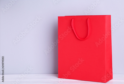 Red shopping bag on a grey background