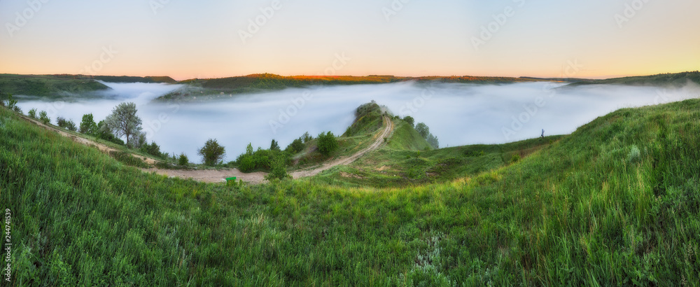 foggy spring morning. picturesque dawn. river canyon