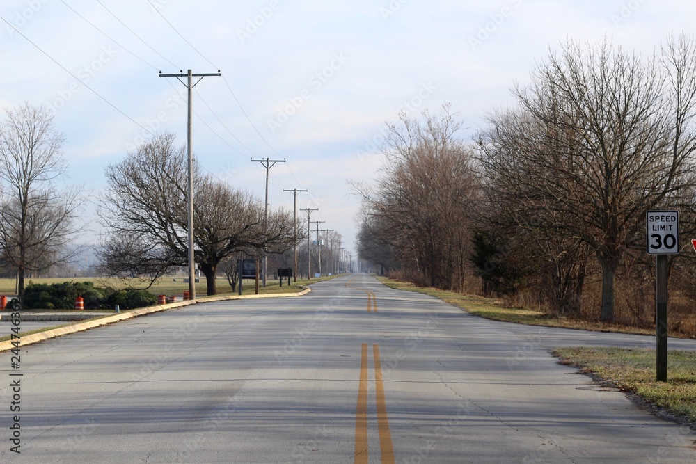 Fototapeta premium A long empty highway road in the countryside.