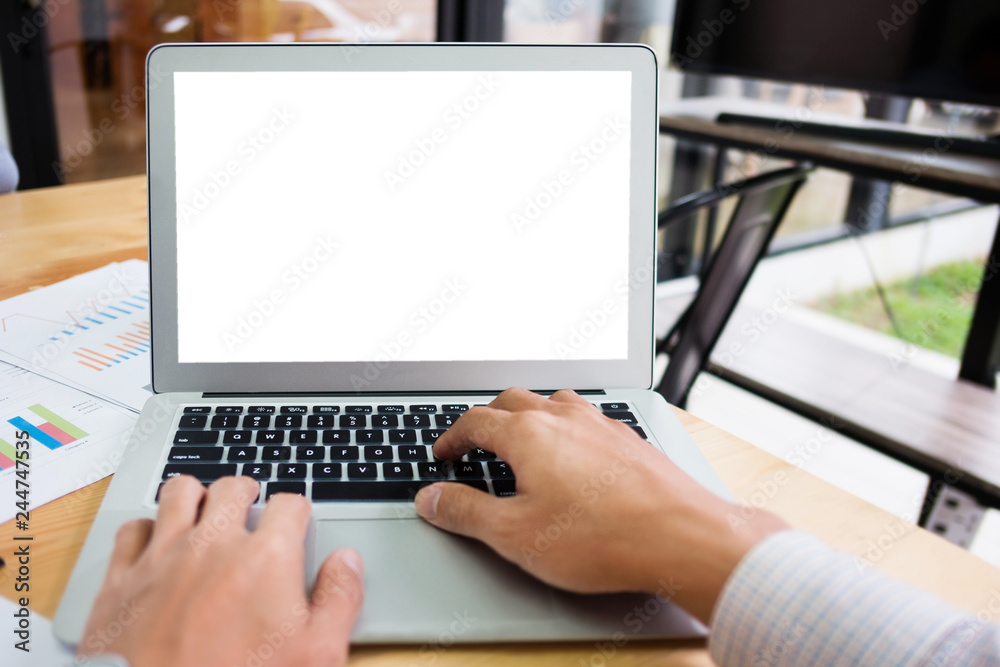 hands of man working on empty white screen laptop in cafe hands of man working on empty white screen laptop in cafe