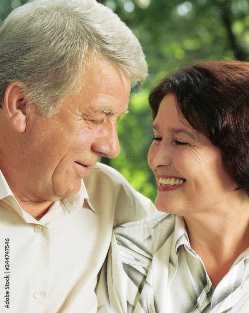 Senior happy couple embracing, outdoors Senior happy couple embracing, outdoors