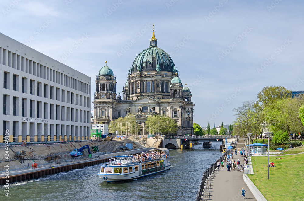 River Spree with tourist boats, Humboldt Forum under construction and Berlin Cathedral