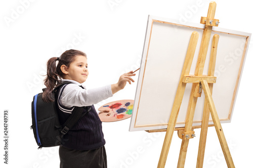 Schoolgirl painting on a canvas