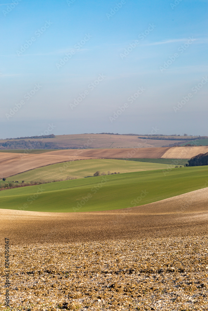 A patchwork landscape in Sussex, on a sunny winters day A patchwork landscape in Sussex, on a sunny winters day