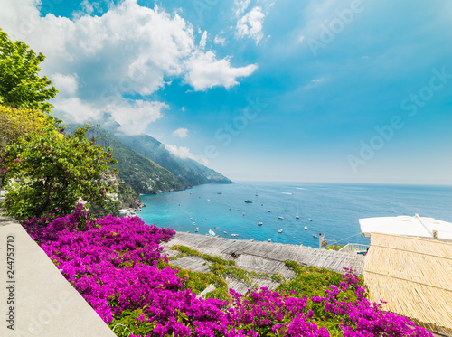 Colorful flowers and blue sea in Positano shore