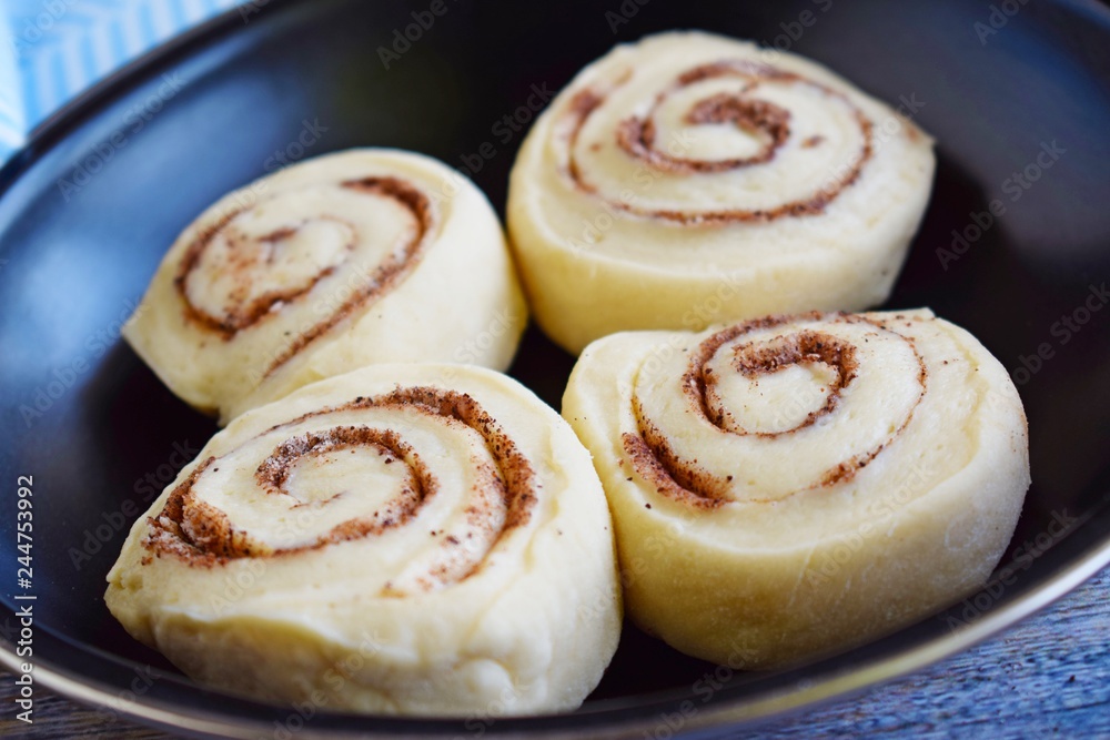 Prepare delicious cinnamon cookies.Dough rolled into a roll, cut into small pieces.