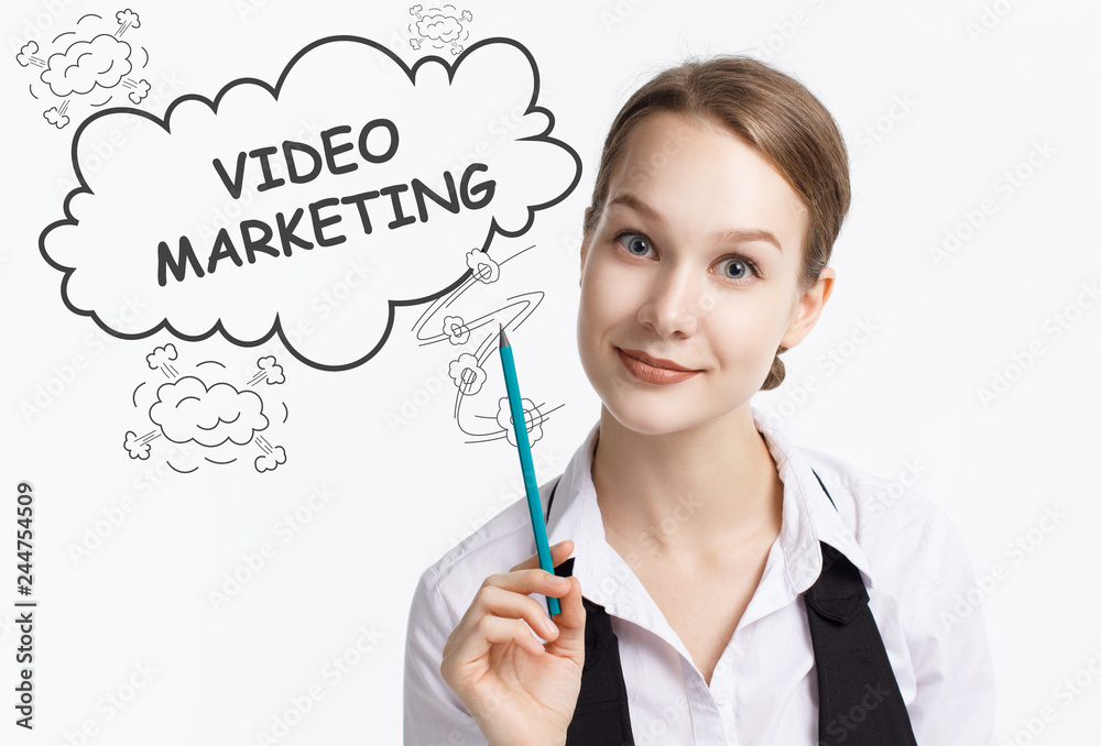 The concept of business, technology, the Internet and the network. A young entrepreneur working on a virtual screen of the future and sees the inscription: Video marketing The concept of business, technology, the Internet and the network. A young entrepreneur working on a virtual screen of the future and sees the inscription: Video marketing
