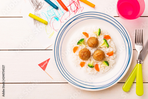 Kid's meal (dinner) - meatballs, rice, broccoli and carrot