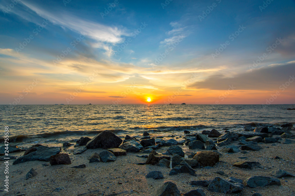Red sky over a rocky seashore. Sunset landscape. Red sky over a rocky seashore. Sunset landscape.