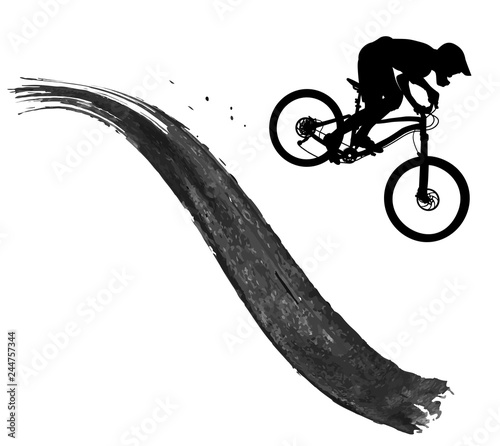 Silhouette of a cyclist riding a mountain bike